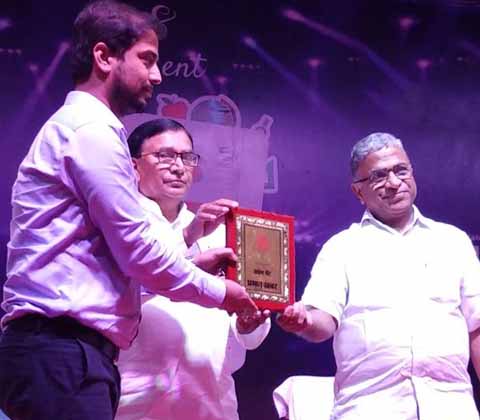 Director Chandan Jha Receiving Award from Honble Education Minister(Bihar)